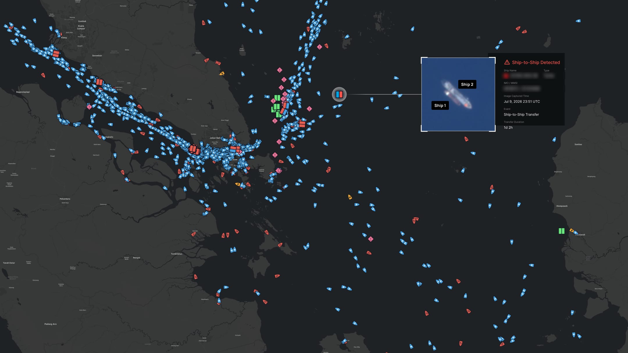 Satellite view of two vessels moored alongside each other in a ship-to-ship transfer detected on the Theia map